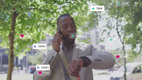 animation of notification bars, african american man looking at smartwatch while talking on phone