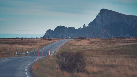 a narrow asphalt road goes along the coastline on the island of andoya