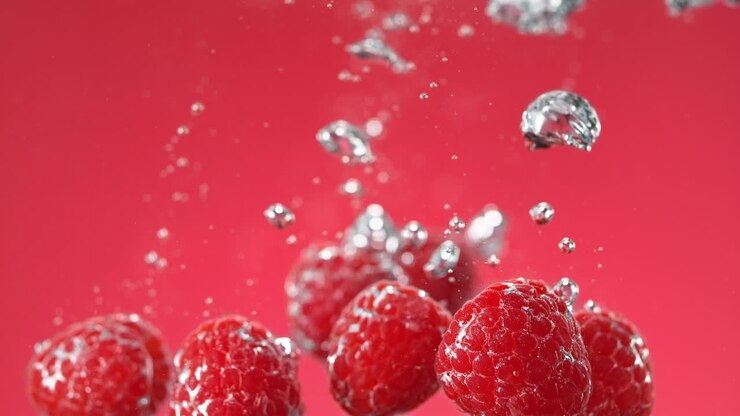 Raspberries Splashing in Water