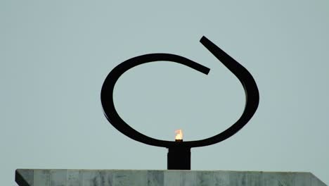 a eternal flame of democracy projected by oscar niemeyer in brasilia - the flame represent the democracy and freedom