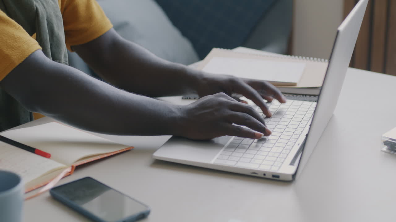 Person Typing on Laptop at Home or Office