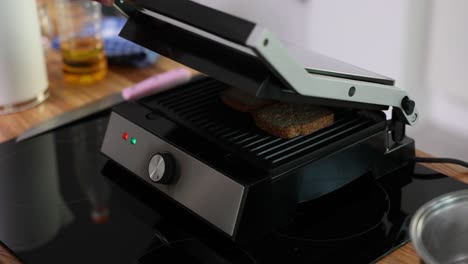 making toast on a kitchen grill