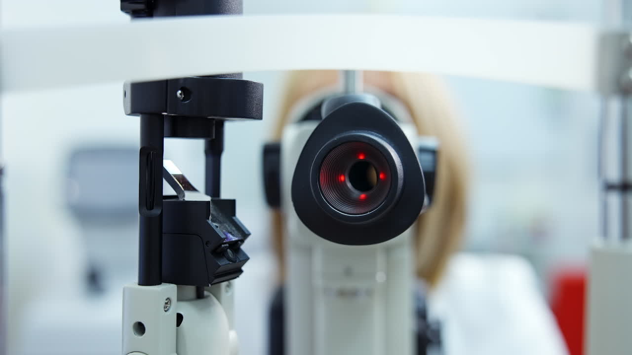 Patient checking vision with equipment. Doctor optometrist examining with special eye equipment
