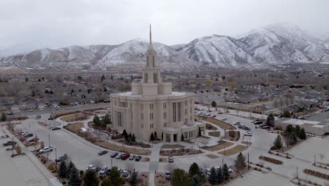 lds mormon payson temple on cloudy, snowy day in utah - aerial