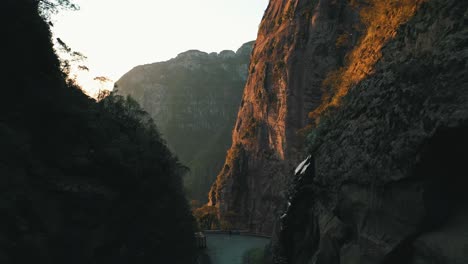 Amazing-road-inside-a-mountain-crack-with-big-rocky-walls-on-both-sides,-Serra-Do-Corvo-Branco,-Grão-Pará,-Santa-Catarina,-Brazil