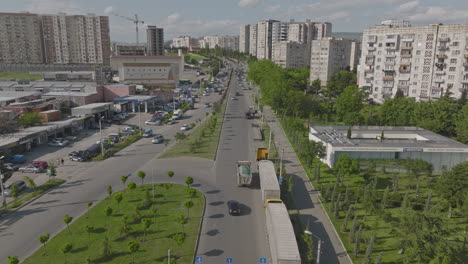 Slow-aerial-shot-overhead-cars-traveling-through-the-strees