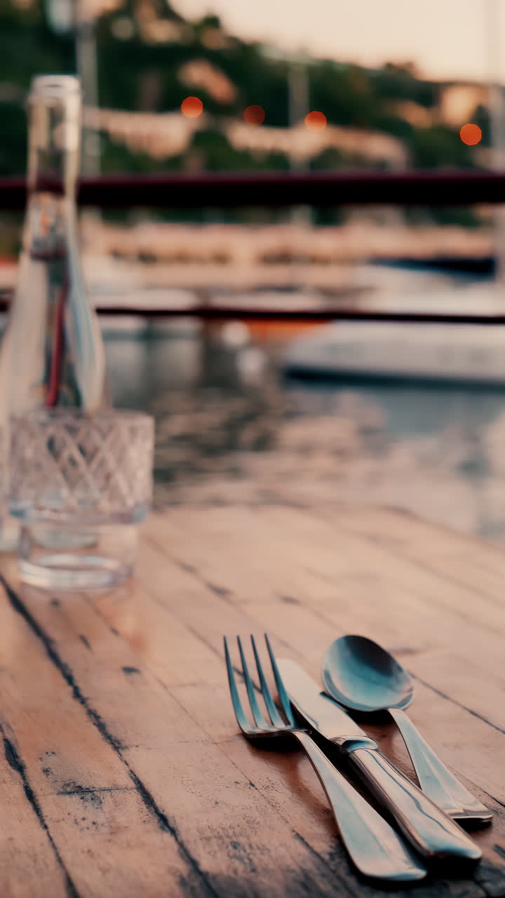 Close up view of a set table and the atmosphere at a restaurant near a port in the south of France