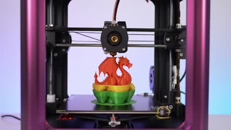 a stunning view of a 3d printer creating a vibrant dragon model, showcasing advanced technology in custom art and innovative design processes