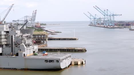 Shipyard-and-ships-in-Mobile-Bay-in-Mobile,-Alabama-with-close-up-parallax-view-and-drone-moving-right-to-left