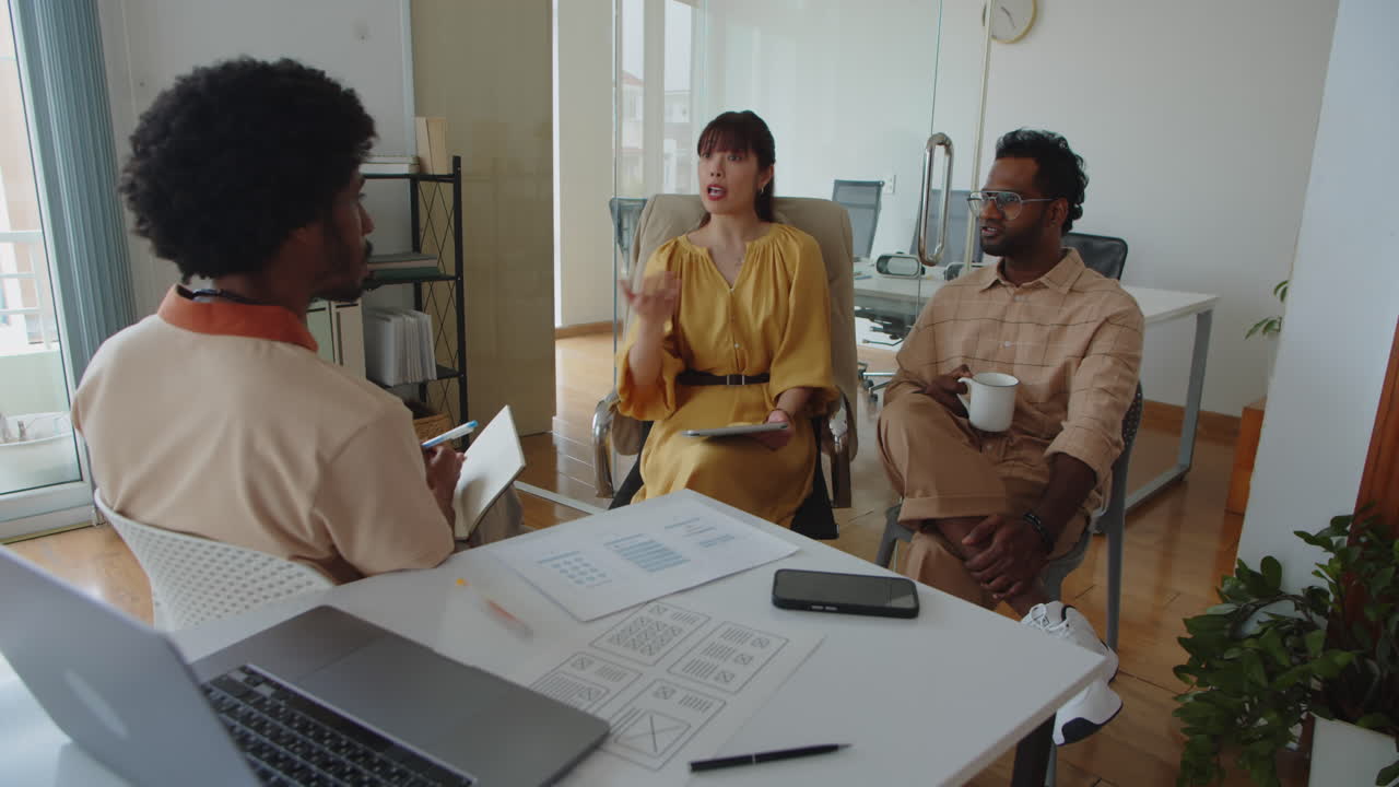 Diverse Team of Developers Discussing Ideas about Project