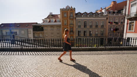 A-Girl-is-walking-though-a-view-point-in-Lissabon,-Portugal