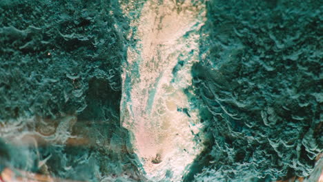 close-up view of teal mineral with bubbles