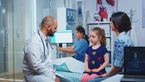 girl and paediatrician doing high five