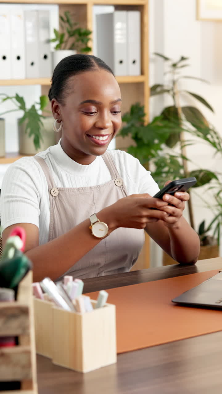 Happy Young Woman Texting on Smartphone in Office