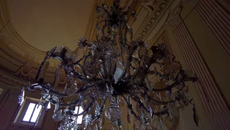 a massive and magnificent crystal chandelier in the baroque castle slavkov near brno, czech republic