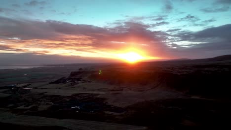 sunset sky over panoramic view of olfus spring mountains in south iceland