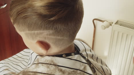 Boy-at-the-hairdresser’s-gets-a-fade-with-a-lightning-bolt