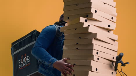 woman balancing food boxes for delivery