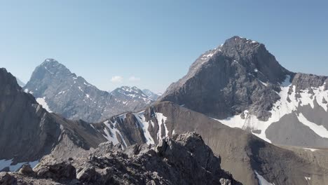 Mountain-range-pan-on-a-sunny-day,-Rockies,-Kananaskis,-Alberta-Canada