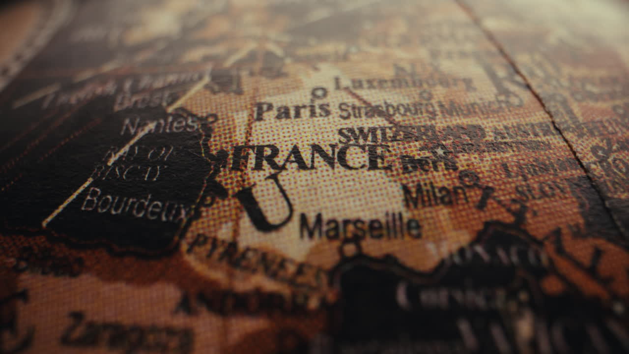 Close-up of a vintage world globe, focusing on France
