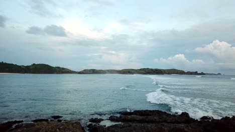 AERIAL-4K-Flyover-Large-Ocean-Rock-Formation-Indonesia-2