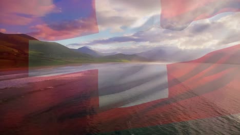 Animation-Der-Flagge-Dänemarks,-Die-über-Der-Strandlandschaft,-Dem-Meer-Und-Dem-Wolkenverhangenen-Blauen-Himmel-Weht