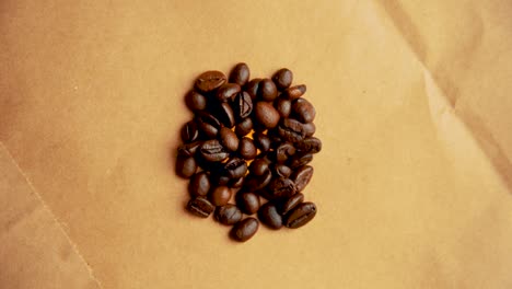 pile of coffee beans rotates in a circle filming from above vintage look