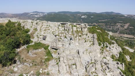 aerial view over ancient thracian city of perperikon in the eastern rhodopes, bulgaria - drone shot