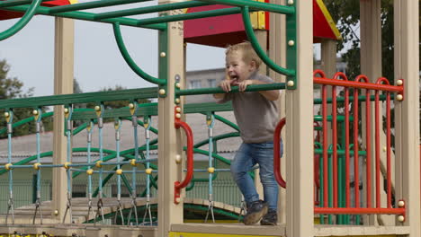 boy on playground equipment