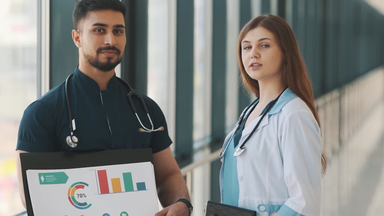 doctor and nurses with computer in the corridor of the hospital