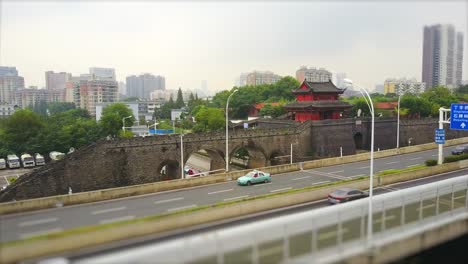 wuhan city qiyimen temple traffic road junction day time aerial panorama 4k tilt shift china