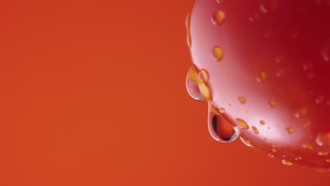 water droplets on a red tomato
