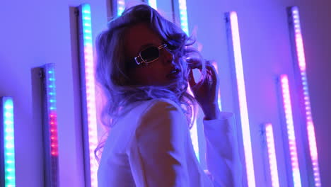 stylish woman in neon lights