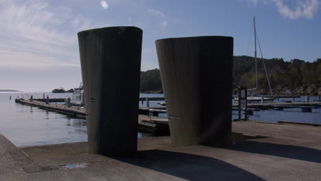 wide shot of two like, to like sculptures at gjestebrygga, kristiansand, harbour,