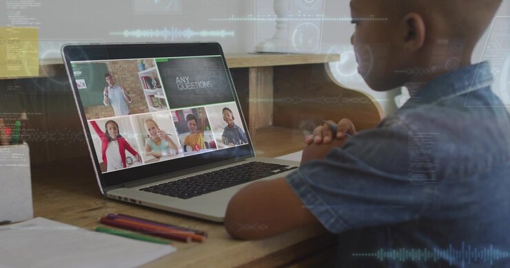 Young Boy Attending Online School Class on Laptop