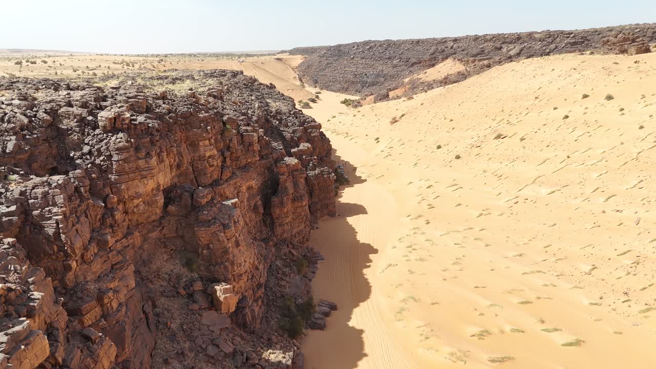 Aerial view of Sahara desert in Mauritania rocky canyon and sand dunes landscape