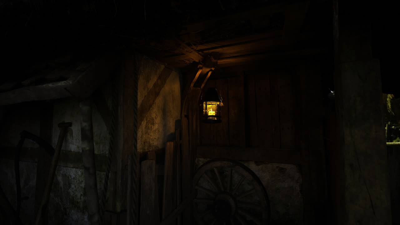 Lantern illuminates rustic wooden cabin at night in tranquil countryside