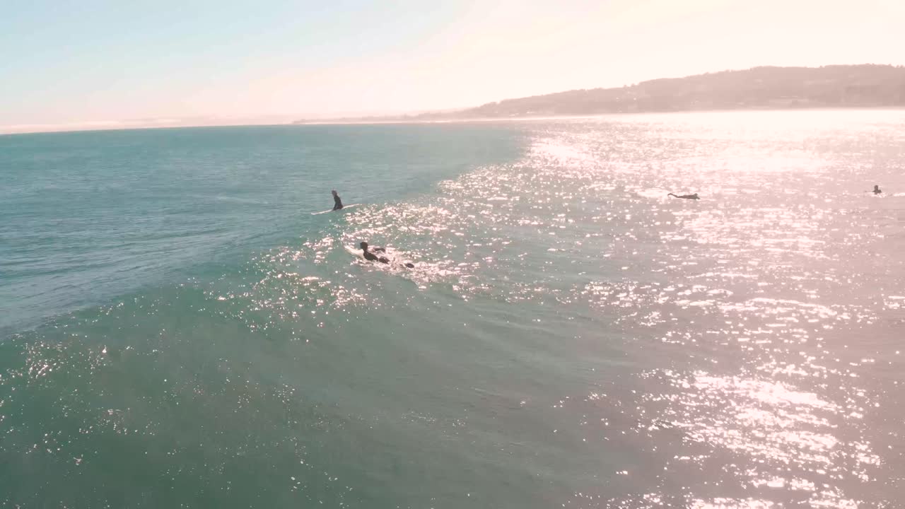 Two surfers chilling on the sea with the sun's reflection, Pichilemu, Chile-4K