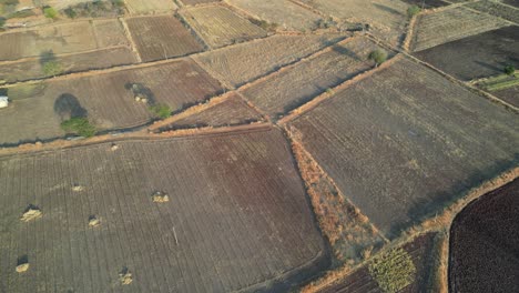 mpty crops field near yamai temple in aundh closeup to wide drone view