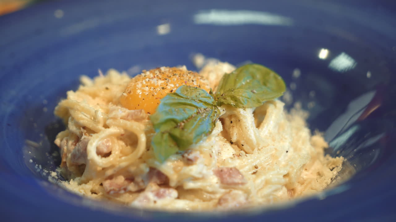 Pasta Carbonara. Spaghetti with bacon, basil, parmesan cheese and yolk. Italian Cuisine.