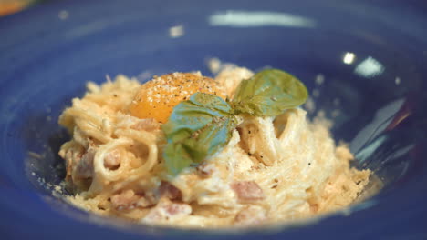 pasta carbonara. spaghetti with bacon, basil, parmesan cheese and yolk. italian cuisine.