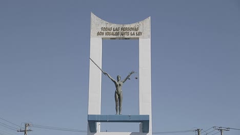 a tilt up shot of the monumento a la constitución in a sunny day