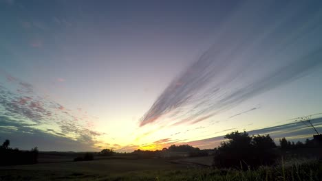 A-timelapse-of-sunrise-over-the-field,-Poland