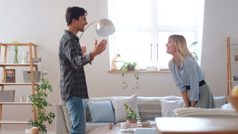 Surprise,-wow-and-couple-in-living-room