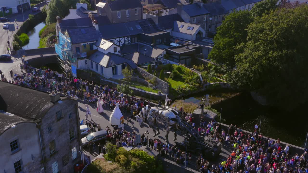 Giant Mechanical Puppet Parade in a Town