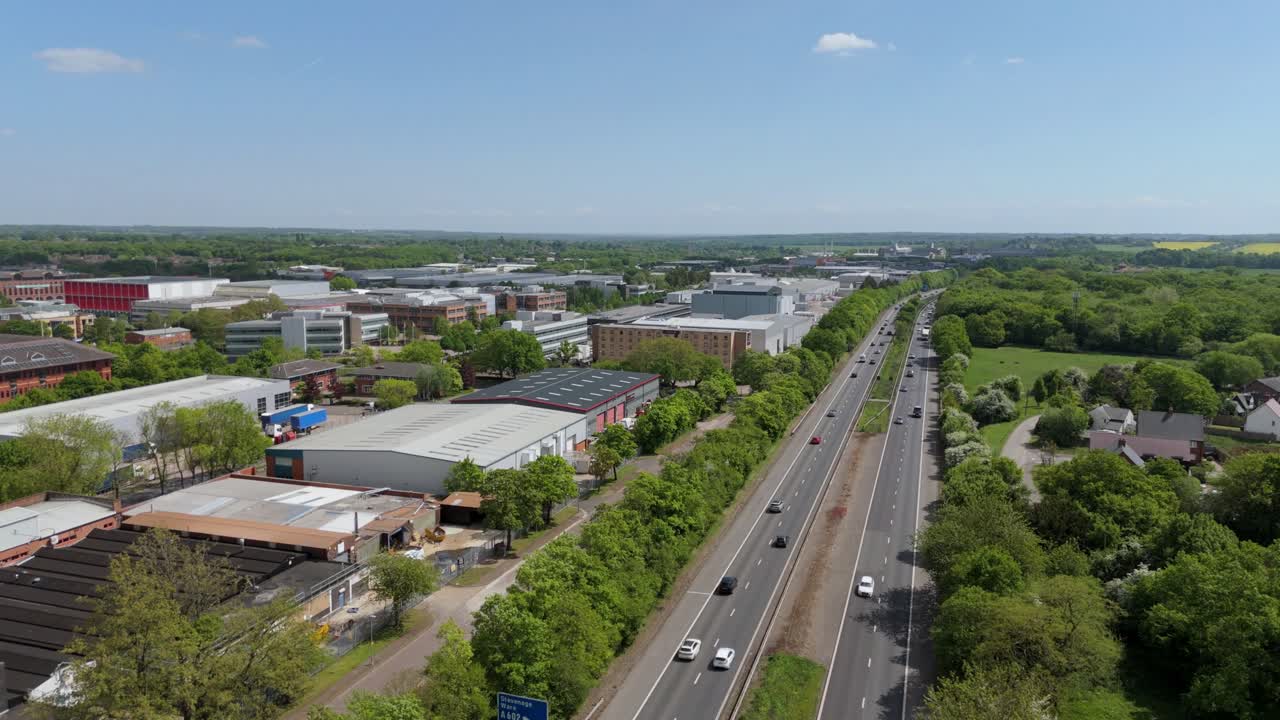 Drone view over UK business park with warehouses and data centres on a sunny day