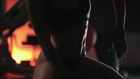 a young beautiful sexy woman dances beautifully in the gym. modern choreography in the gym. dancer