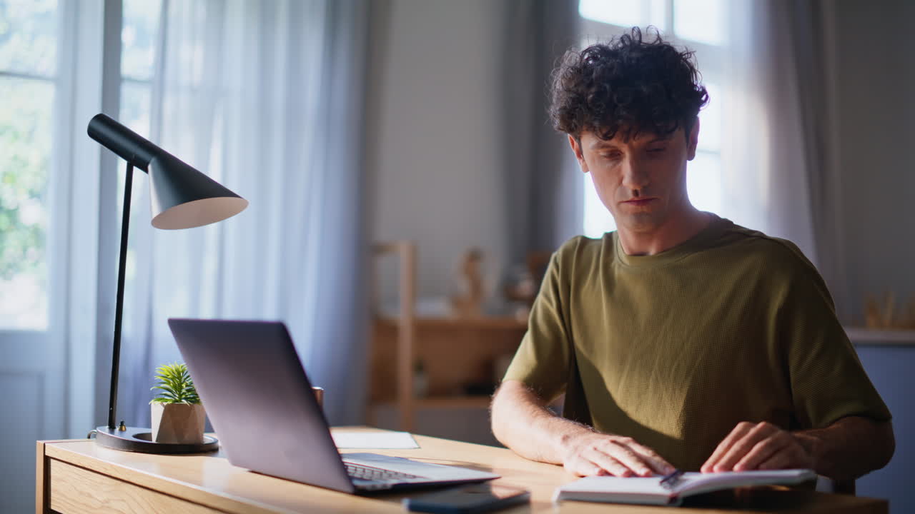 Online student open laptop lid at apartment workplace closeup. Man remote work