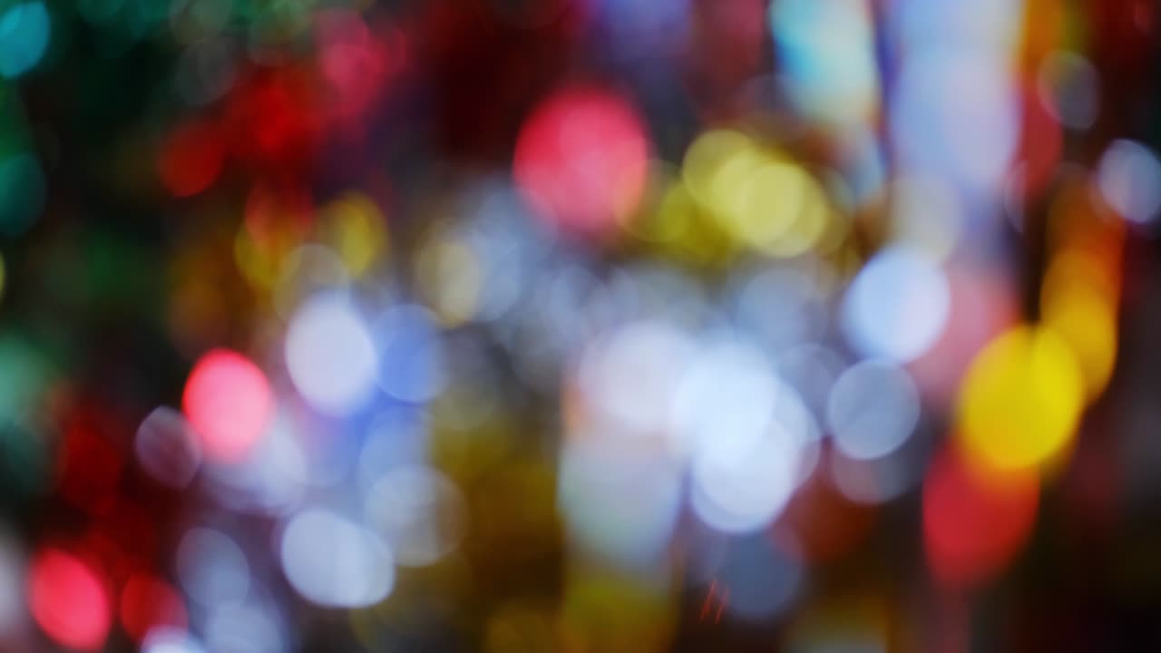Christmas bokeh. Unfocused lights of garlands. Blurry holiday lights background