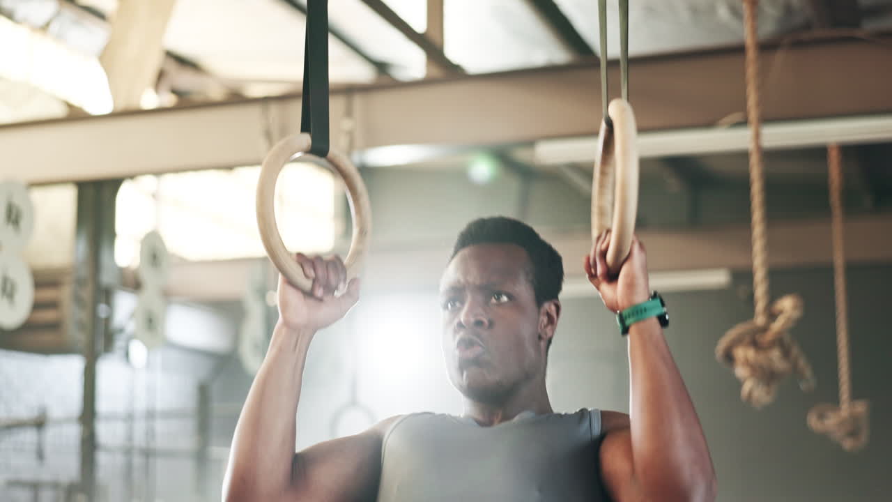 Sports, gymnastics and black man doing pull up